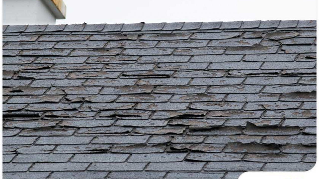 Cracked shingles showing signs of roof deterioration